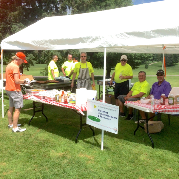 volunteers serve lunch on the turn